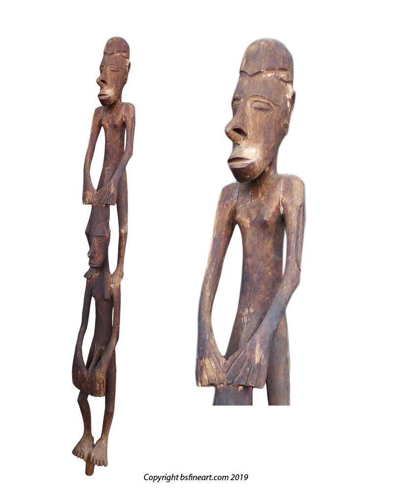 Asmat double canoe sculpture showing two male figures 